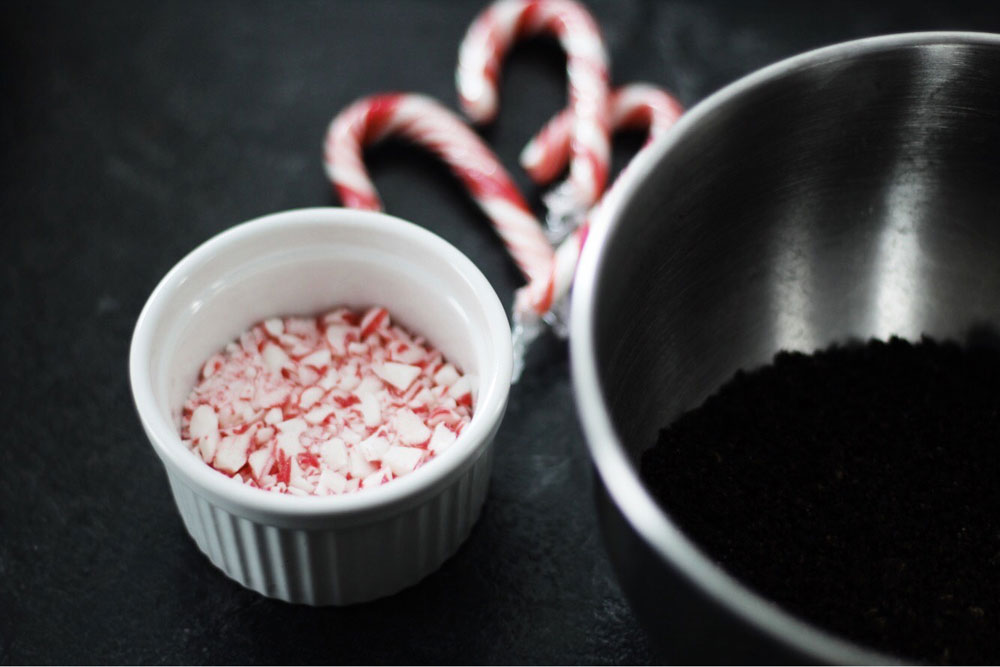 Crushed candy cane and oreo cookie crumbs in bowls